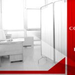 A medical office with desk, chair, partition screens, and text asking if you need a contractor for your medical building.